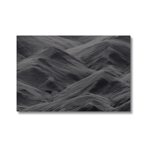 An art print on a metal wall with a sky and sand area on the side.