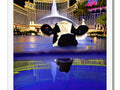 A cows statue sitting in water in Las Vegas.