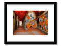 An alleyway with a wall covered in graffiti on a wooden wall with art print on