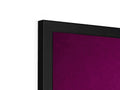 A television with magenta screen on top lying in front of a wall behind it.