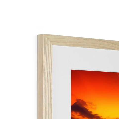 A photograph frame with a picture of a wooden picture of the sun on top of it
