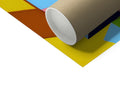 a roll of colored wrapping paper in a small white box next to a piece of cardboard