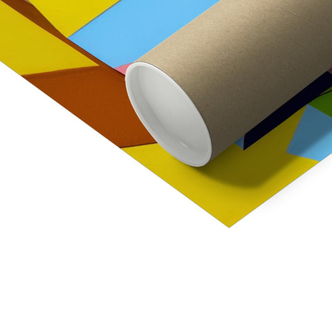 a roll of colored wrapping paper in a small white box next to a piece of cardboard
