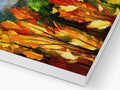 a colorful artwork print with fall leaves and flowers sitting on top of paper.