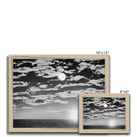 A white picture frame of three images on a white background next to a picture frame.