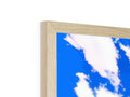 a picture frame made of wood, with a blue sky surrounded by blue sky and clouds