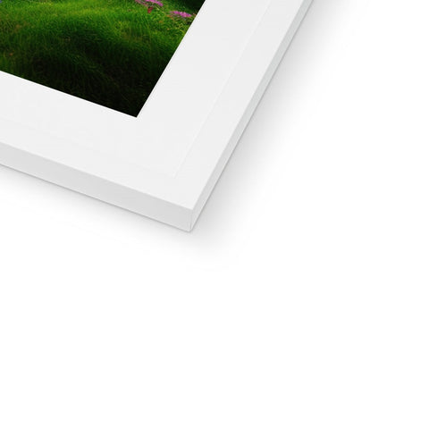 A picture of a white image on a picture frame with a silver frame.