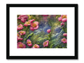 An art print of flowers on a window ledge next to a pond.