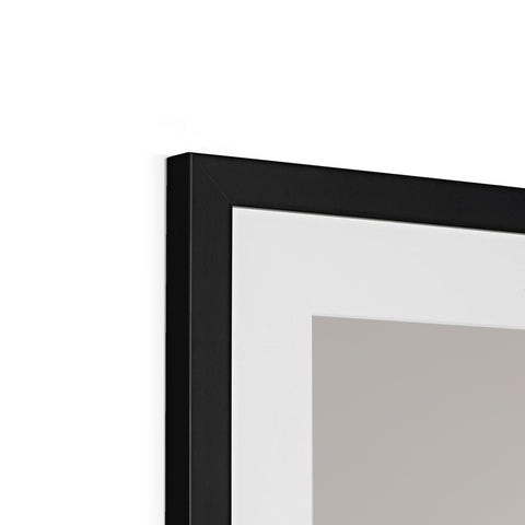 A picture frame with a mirror with black background is attached next to a television.