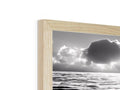 A photo frame with a frame with clouds on it surrounded by a wooden frame.