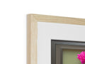 A photo of a white wooden picture frame sitting in a frame holding it and other items