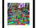A street with umbrellas on a street on a sunny side with an art print