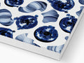 a blue and white print tablecloth on paper with tiles of different designs