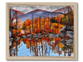 A wall hanging with colorful pictures of fall foliage outside.