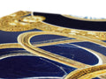 A piece of fabric that is very ornately set in gold and blue fabric.