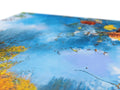 A colorful paper placemat on top of an image of the Earth