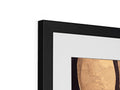 An image of a picture frame in a gold frame hanging on a wall.