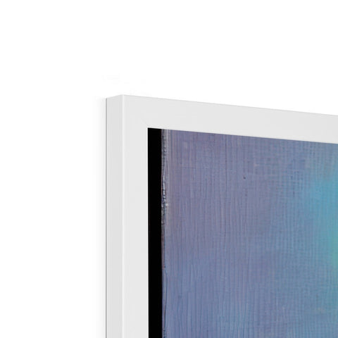 An imac laptop sitting on a white display wall with a small view of a painting