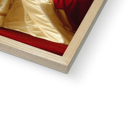 A wood framed photo on a white framed bed with a book cover in it's background