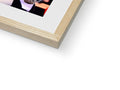 A picture of a hand holding a softcover photo sitting inside of a wooden frame on