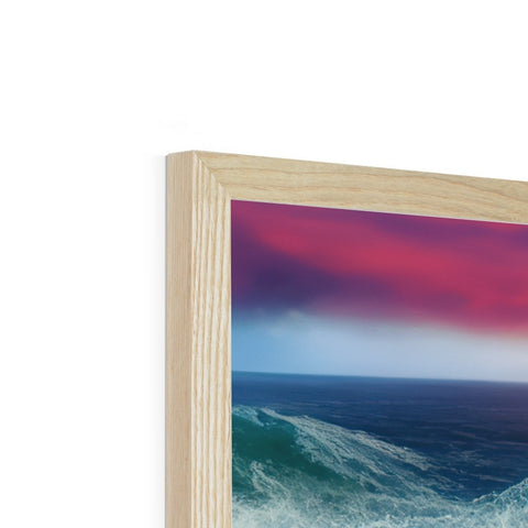 a wooden picture frame with a sunset on the ocean is on top of a glass table