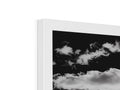 A picture frame is displayed on a white background with a picture of clouds.