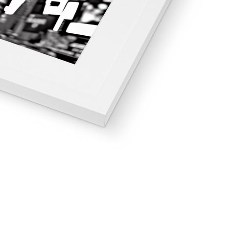 A white picture of an image on a stack of printed pages.