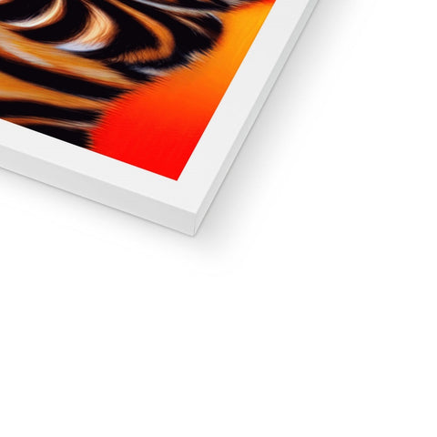 An orange and black art print sitting on a softcover print.