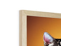 An animated photo of a cat sitting on top of a wooden frame with a picture.
