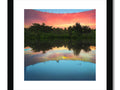Art print with sunset and lake reflection on it.