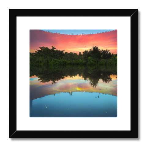 Art print with sunset and lake reflection on it.