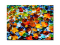 A colorful tiled wall hanging a mosaic tile with an abstract painting.