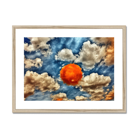 A framed picture of an orange sky in the sky with lots of clouds.