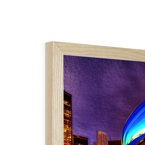 A picture frame is sitting on top of a wooden work of art.