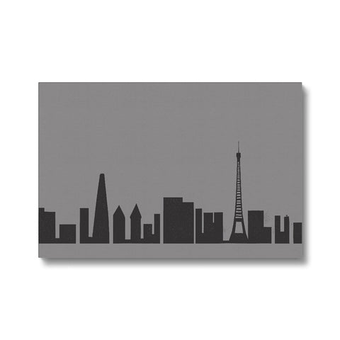 A decal sticker sticking to a large white wall with a city skyline and a sky