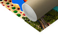 A colorful roll of paper and a paper roll is folded on a plastic bag.