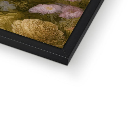 A large photograph of flowers lying in a glass frame with a piece of art on it