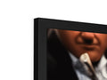 A picture frame containing a tv that is close up of a flat panel television.