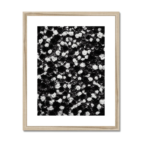 A black and white art print laying on top of a wood flooring tray.