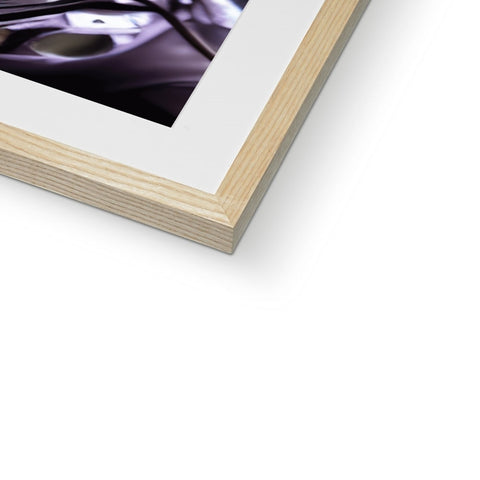 A soft colored picture of a book holding a photo on a frame.