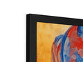 A picture frame with art on top of it shows an abstract painting.