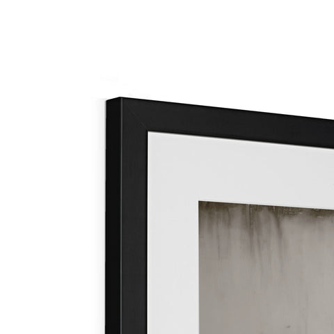 A picture frame in white with black paint hanging high in the room.