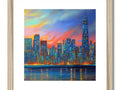 A framed art print of a skyline with a sunrise and a light reflecting in a building