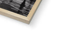 A wood framed picture that is on a book cover.