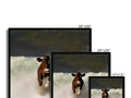 A cow looks at an image on top of a computer monitor sitting in the foreground and