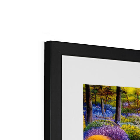 A picture frame is in a black photo frame with colorful art prints on it.