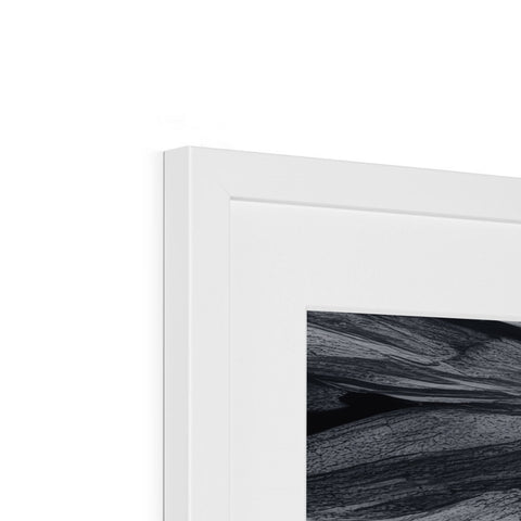 A picture of an abstract painting in black and white on a white picture frame.