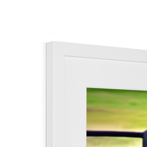 A picture frame holding framed photographs in colorful frames with the name "Imac" on