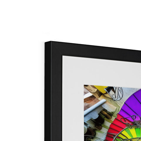 A colorful image of a rainbow in a glass frame of artwork. �