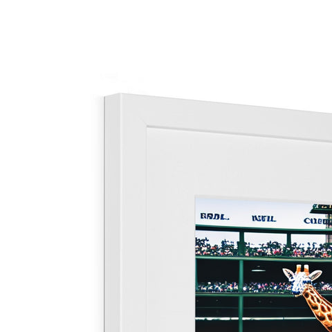 A picture frame with baseball players on it is displayed on a white wall.